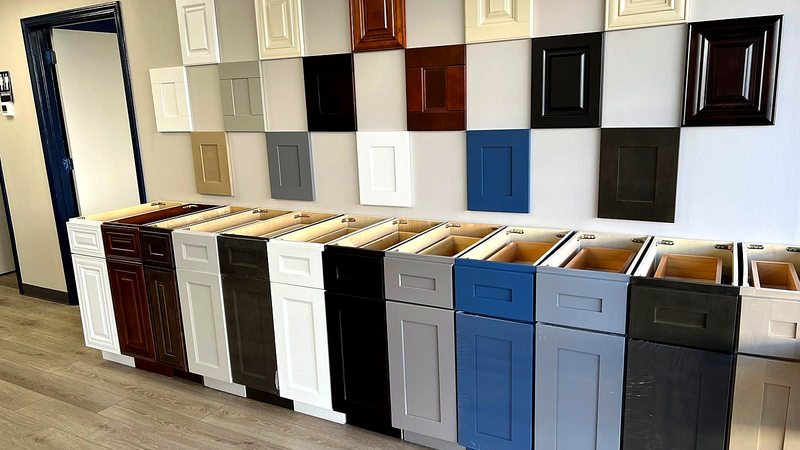 MNK Cabinet showroom display with gray kitchen cabinets and door samples in Norcross, GA