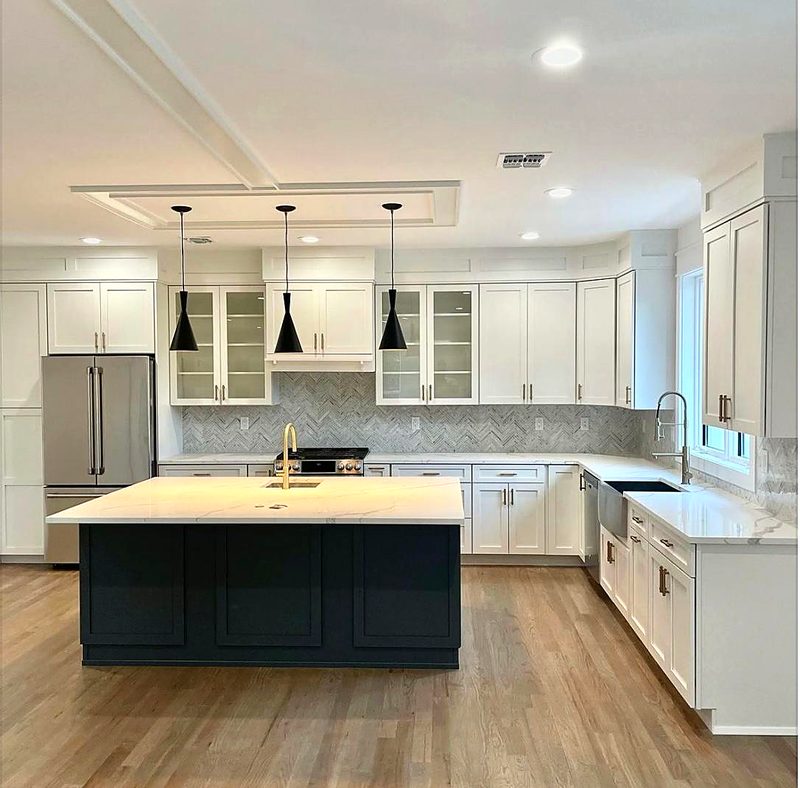 Same white shaker kitchen with navy shaker island and calacatta quartz, gray — kitchen by MNK Cabinet in metro Atlanta